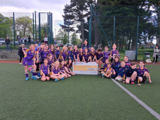 Under 12 girls present €1,050 cheque to Temple Street 