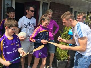 "Faces Behind the Purple & Gold" launched to great acclaim