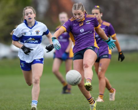 number 14 kicking with left foot